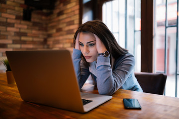 Young business woman is having headache because of work