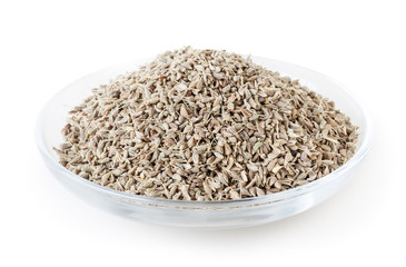 Anise seeds in glass bowl isolated on white background with clipping path