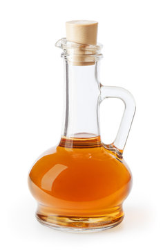 Apple cider vinegar in glass bottle isolated on white background with clipping path