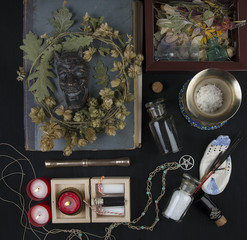 Occult altar with Pan's face, wreath of hops 