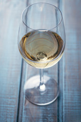 White wine on blue wood