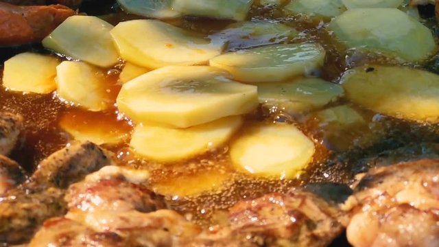Slow motion of food grilling in a disc grill