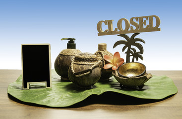 Coconut spa set with close sign and blank black board