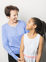 black girl child with grandmother in studio white background