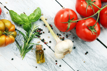 Various types of tomatoes on vintage background