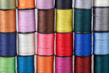 Multi-colored threads for needlework on reels