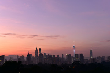 Fototapeta na wymiar beautiful landscape view of Kuala Lumpur cityscape skyline with sunrise view in dawn and buildings in silhouette