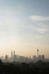 Fototapeta na wymiar vertical or potrait image of Beautiful Kuala Lumpur cityscape skyline in the morning environment and the buildings in silhouette. tourism and development concept