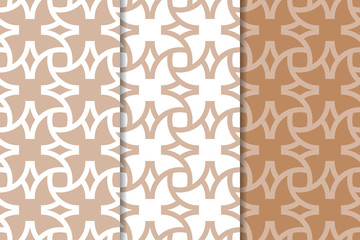 Brown and white geometric ornaments. Set of seamless patterns