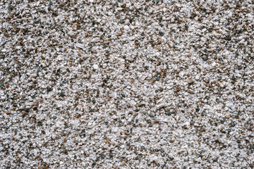 Wall with small stones as texture background.