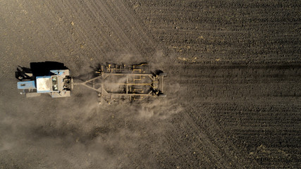 Fototapeta na wymiar Aerial view of a tractor on a field