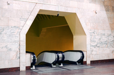 Fototapeta na wymiar Entrance and exit of the metro escalator