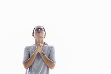 Young asia woman praying on white background
