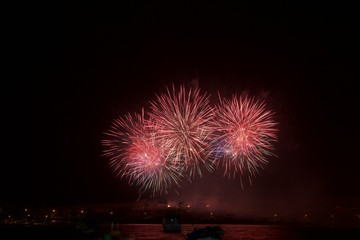 Red fireworks isolated in dark sky background. Orange firework. Amazing fireworks, fireworks 2017, fireworks background, fireworks event,
