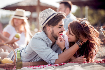 Romantic young couple on the beach,enjoying together.