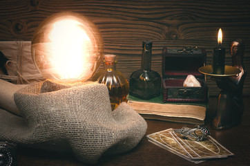 Crystal ball and tarot cards on fortune teller desk. Future reading concept. Paranormal magic table.