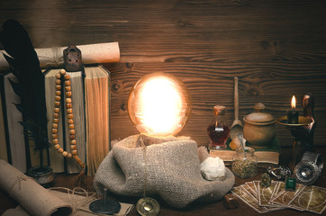 Crystal ball and tarot cards on fortune teller desk. Future reading concept. Paranormal magic table.