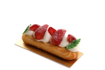 Choux cream with strawberry isolated in white background