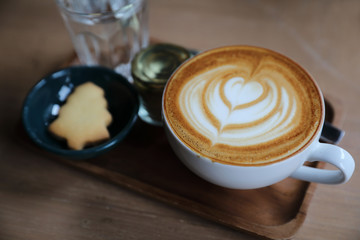 Cappuccino coffee cup on wood background