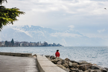 Man on the shore of the lake.