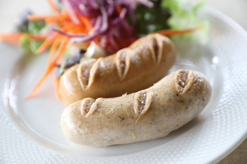 Grilled Pork Sausage on dish in close up