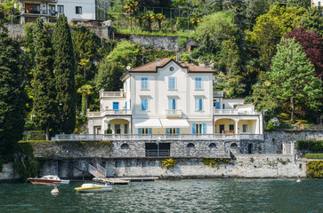 Fototapeta na wymiar Quaint traditional waterfront houses on majestic Lake Como, Lombardy, Italy.