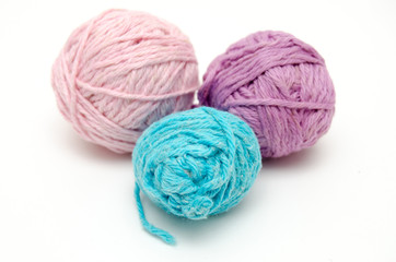 Fototapeta na wymiar Colorful balls of yarn isolated on white