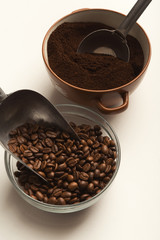 Top view on coffee beans and power bowls on white background