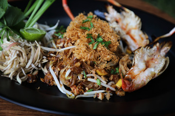 Shrimp pad thai noodles with shrimps on top , Thai food