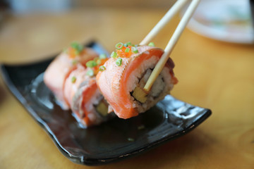 Salmon egg on sushi nigiri roll