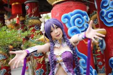 Portrait of asian young woman with purple Chinese dress cosplay with temple