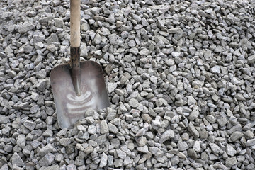 simple shovel in a pile of stones