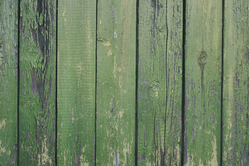 Fototapeta na wymiar wooden green background with peeling paint