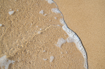 Fototapeta na wymiar Wave washing up on the shore