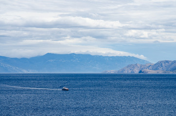 Boat in the sea near mountains