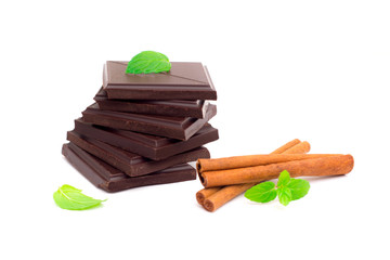 Stack of dark chocolate pieces isolated on white