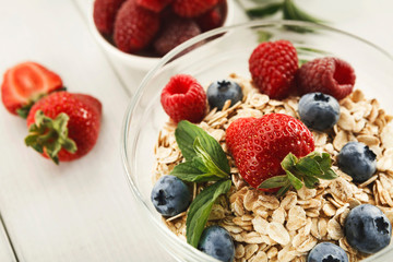Healthy breakfast on white wooden table, closeup