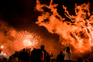 Crowd of people watching Canada Day fireworks celebration outside the Canadian Museum of History, Gatineau, Quebec, Canada