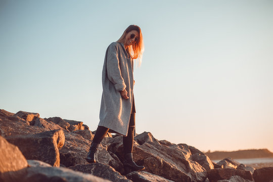 Portrait of woman wearing sunglasses and winter coat looking at camera smiling, Odessa, Odeska Oblast, Ukraine, Eastern Europe