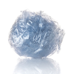 Crumpled plastic ball isolated on white