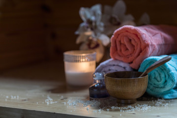Spa Concept. Beautiful Spa Products and  flowers on wooden table, copyspace