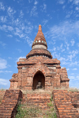 Fototapeta premium Ancient pagoda with Buddha statue inside in Bagan, Mandalay Division, Myanmar