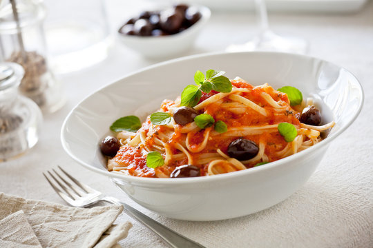 Plate Of Pasta With Tomato Sauce And Olives