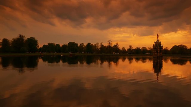 Wide establishing shot of the amazing Bushy Park in the Hampton Court region in London, England, UK during golden hour sunset