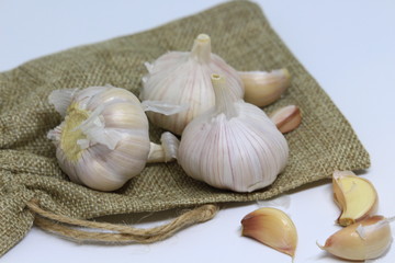 Garlic for cooking on wooden floor