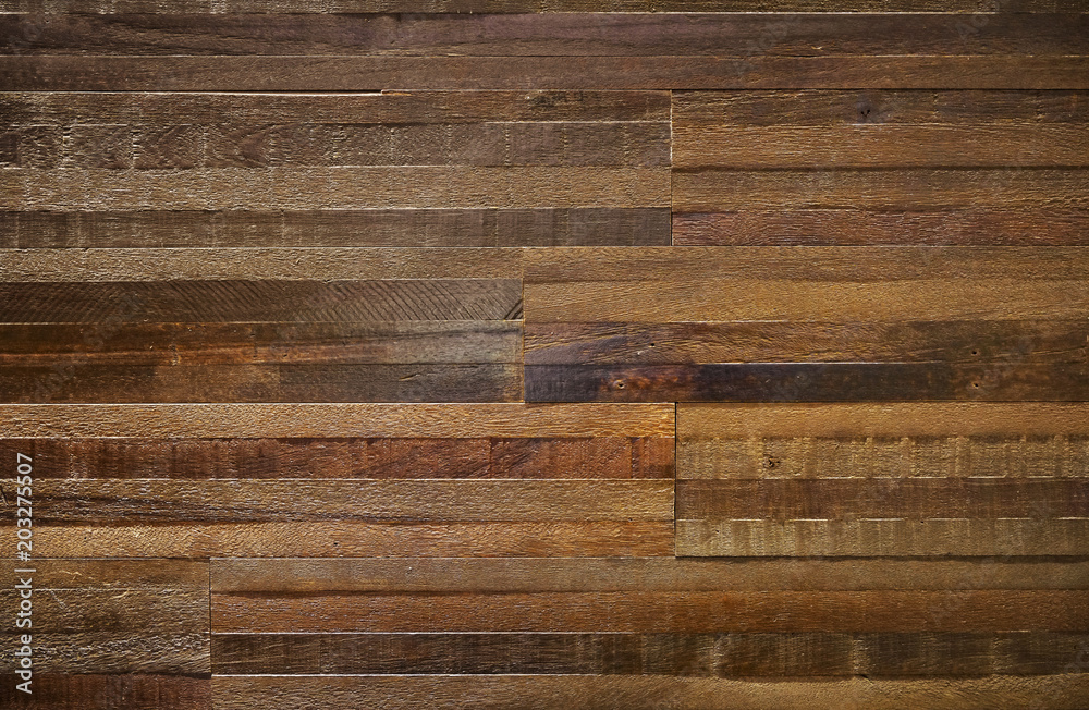 Wall mural Thick wood block wall of reclaimed wood with rough texture.