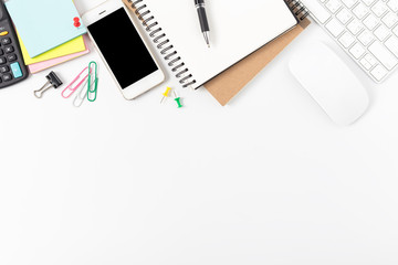 office desk with smartphone, computer and office supplies top view