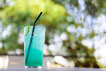 Beverage drink : Lemonade with mint and soda water with bokeh of green garden background.