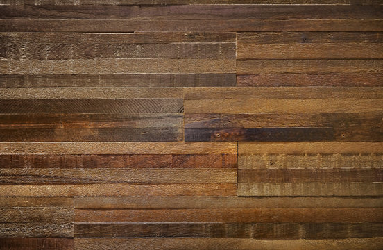 Thick wood block wall of reclaimed wood with rough texture.