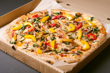 Vegetarian pizza with vegetables in cardboard box. Delivery